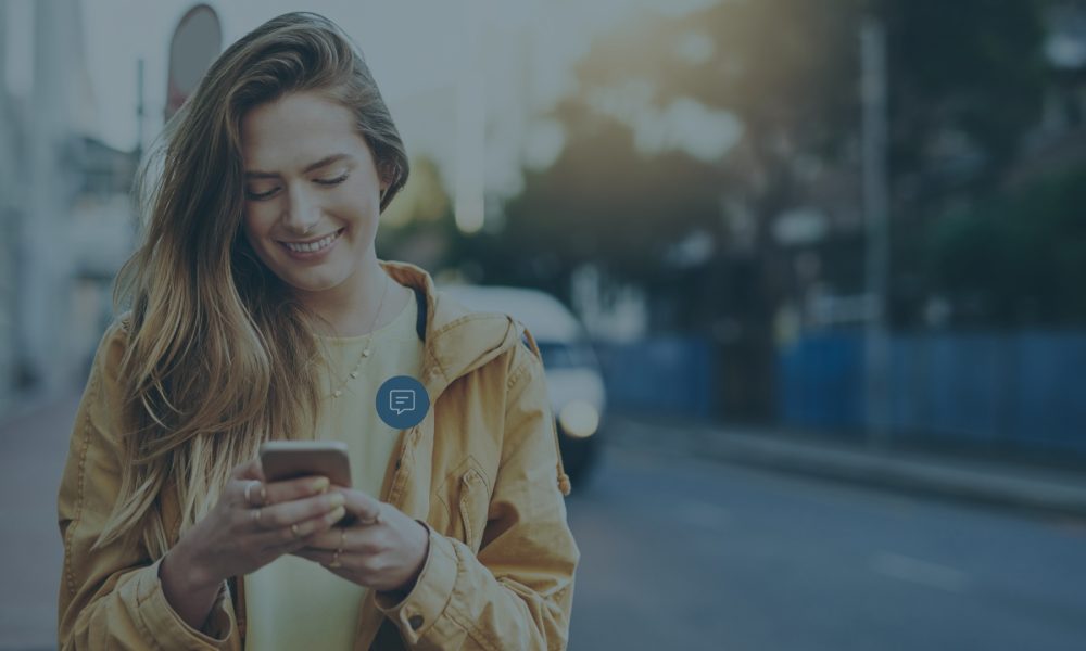 Girl sending SMS dark